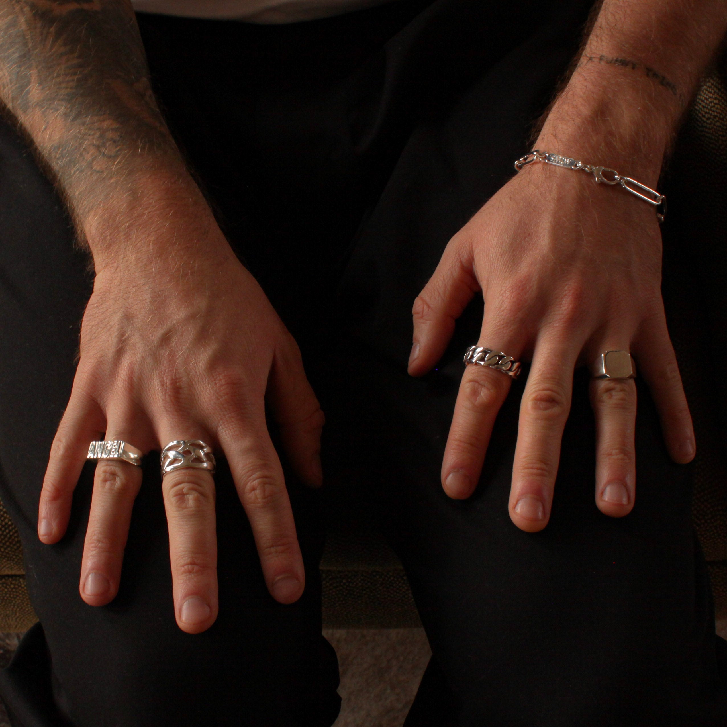 Antares Statement Silver Rings on Male Model's Hands